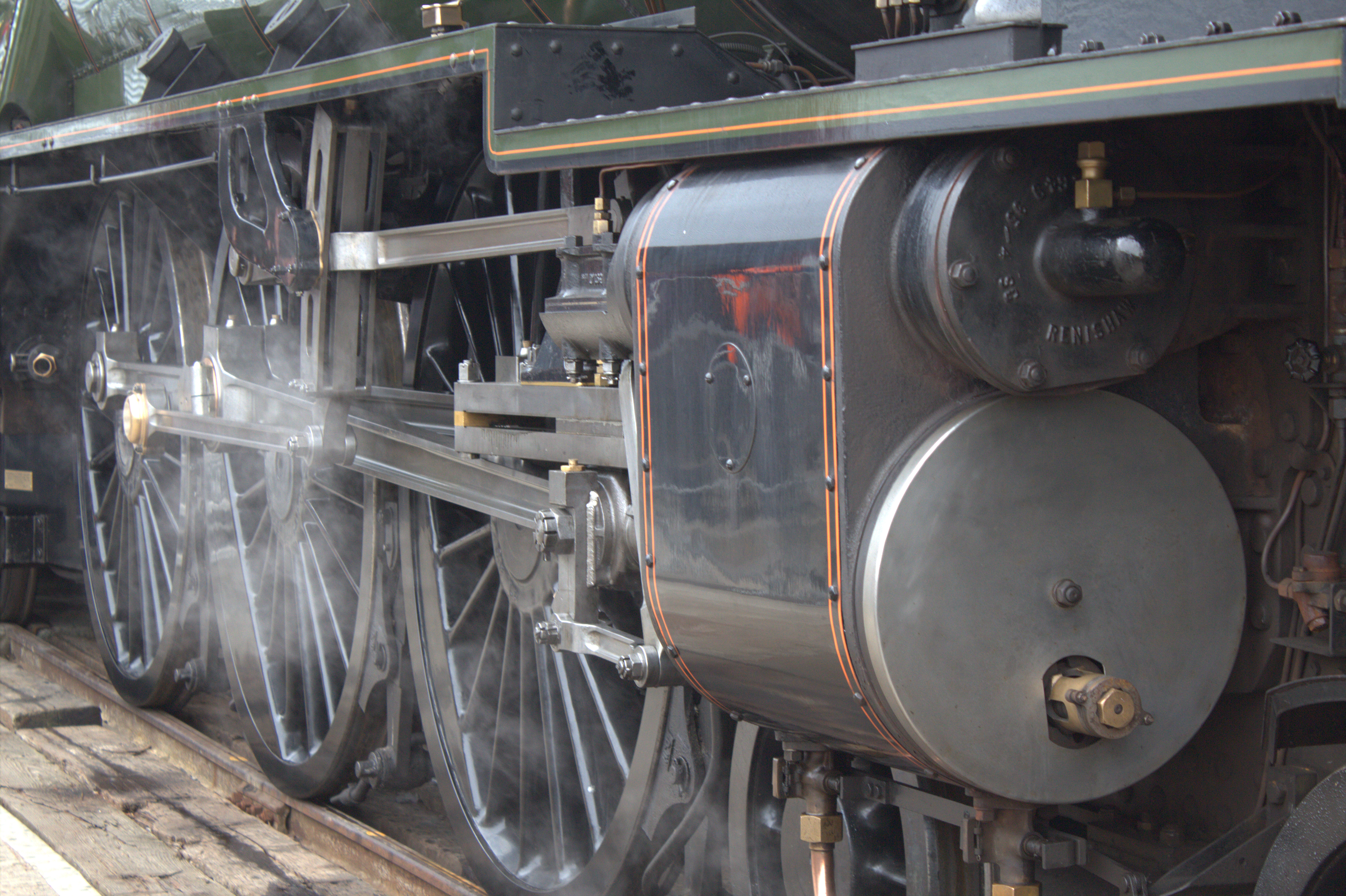 The wheels of a steam locomotive
